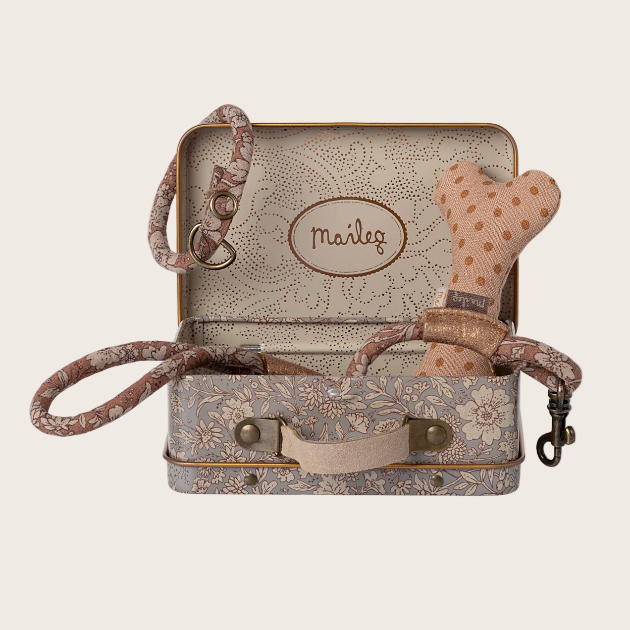 Vintage-style suitcase with a dog toy
