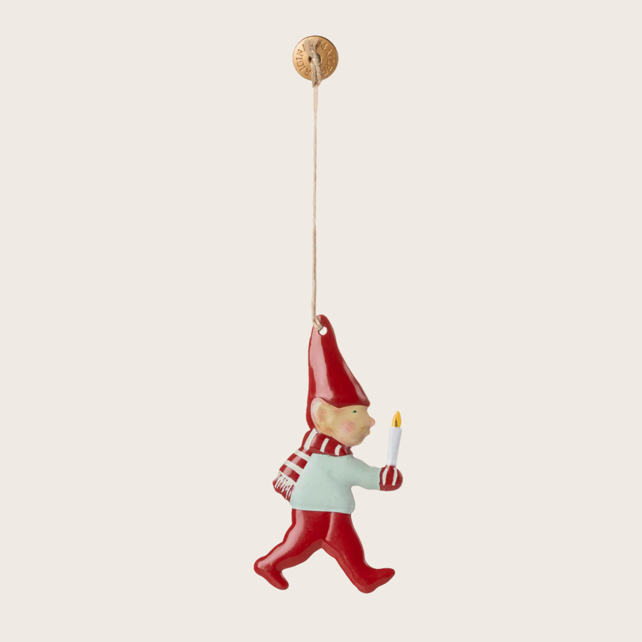 Decorative gnome ornament with a candle on a white background
