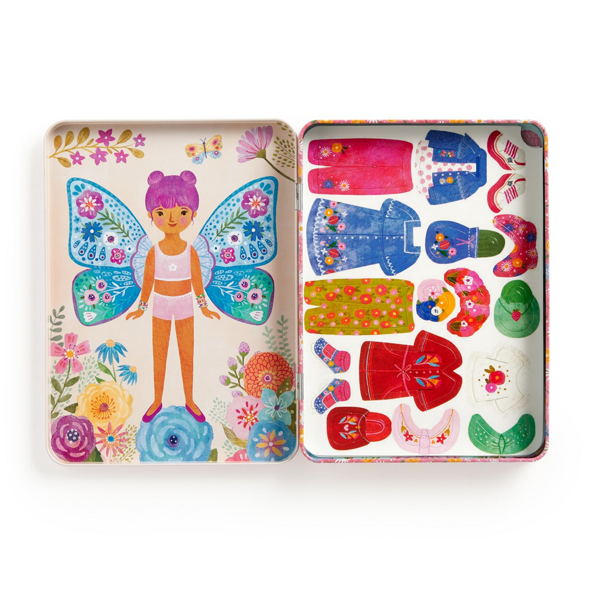 Colorful toy set with a fairy figure and various outfits in a tin box