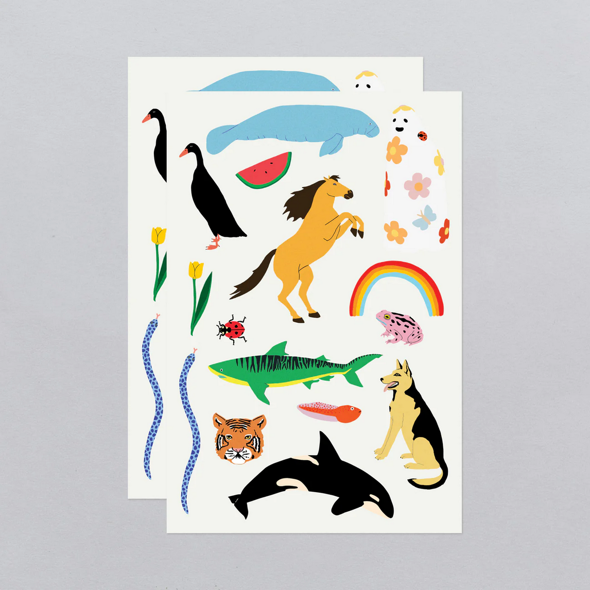 Sheet of colorful animal and nature-themed temporary tattoos on a white background.