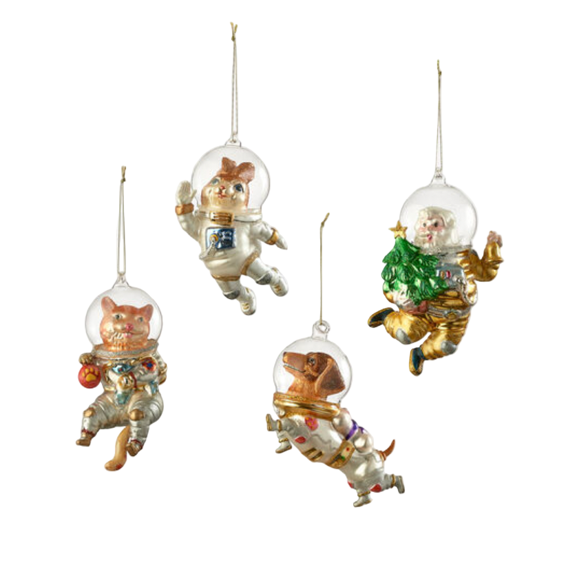 Set of four decorative Christmas ornaments featuring cats in space suits on a white background.
