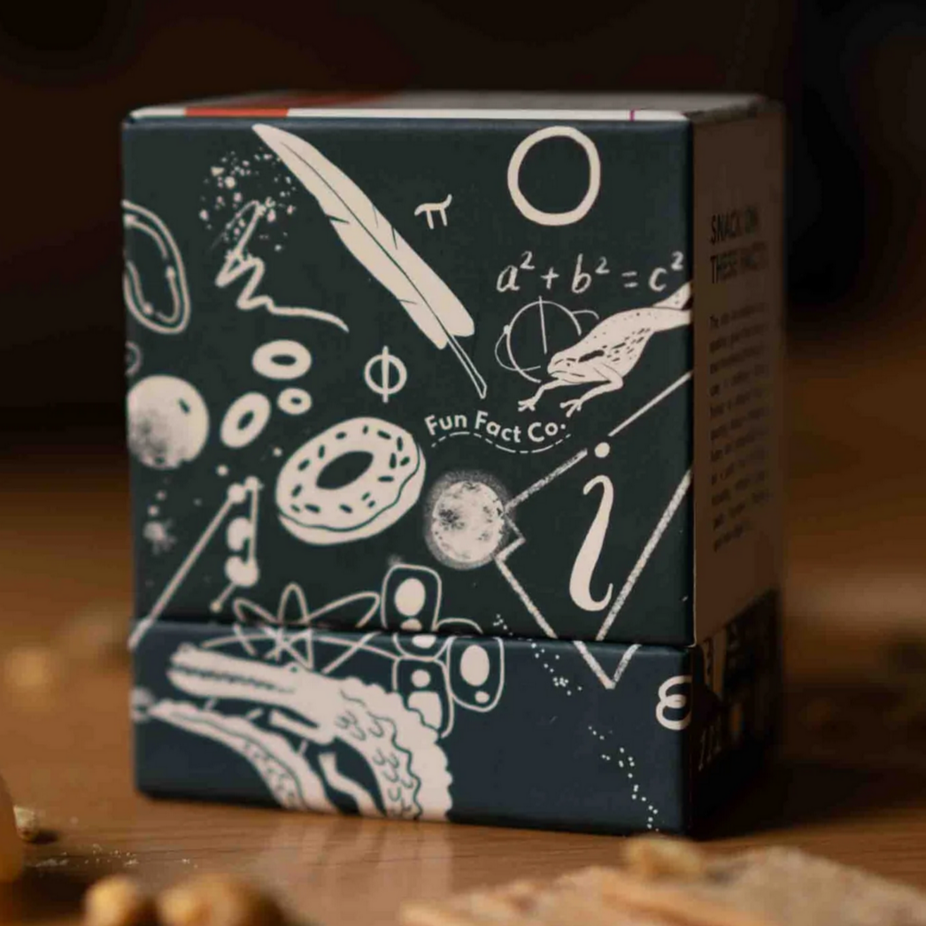 Box with scientific illustrations on a wooden surface