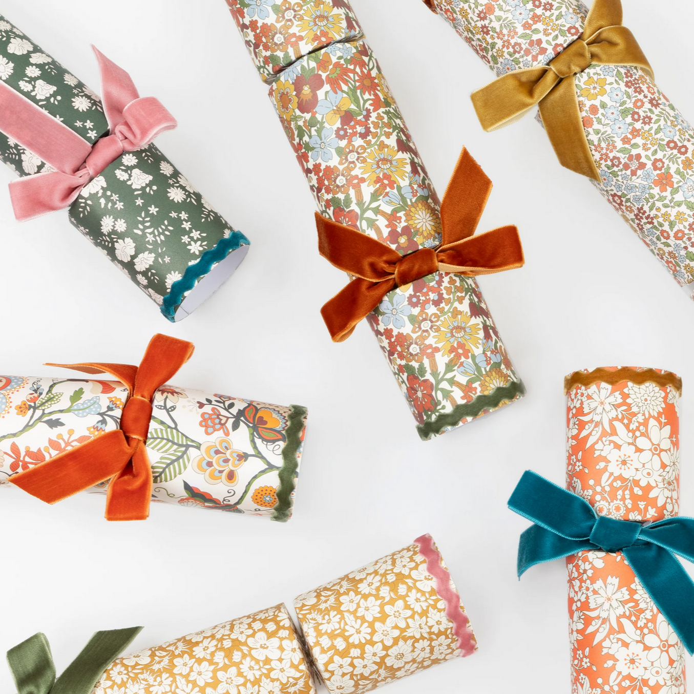 Decorative rolls of paper with colorful ribbons on a white background
