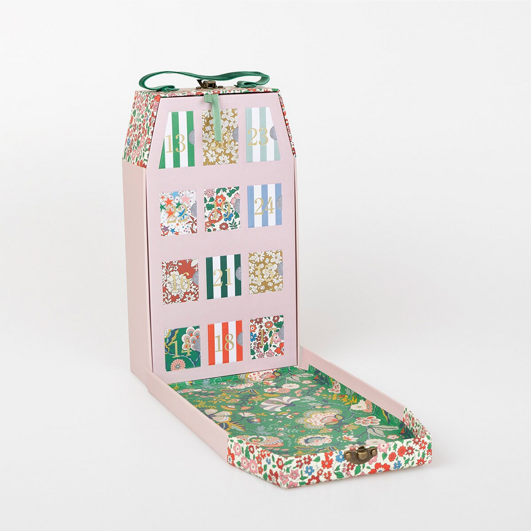 Floral and striped patterned box on a white background