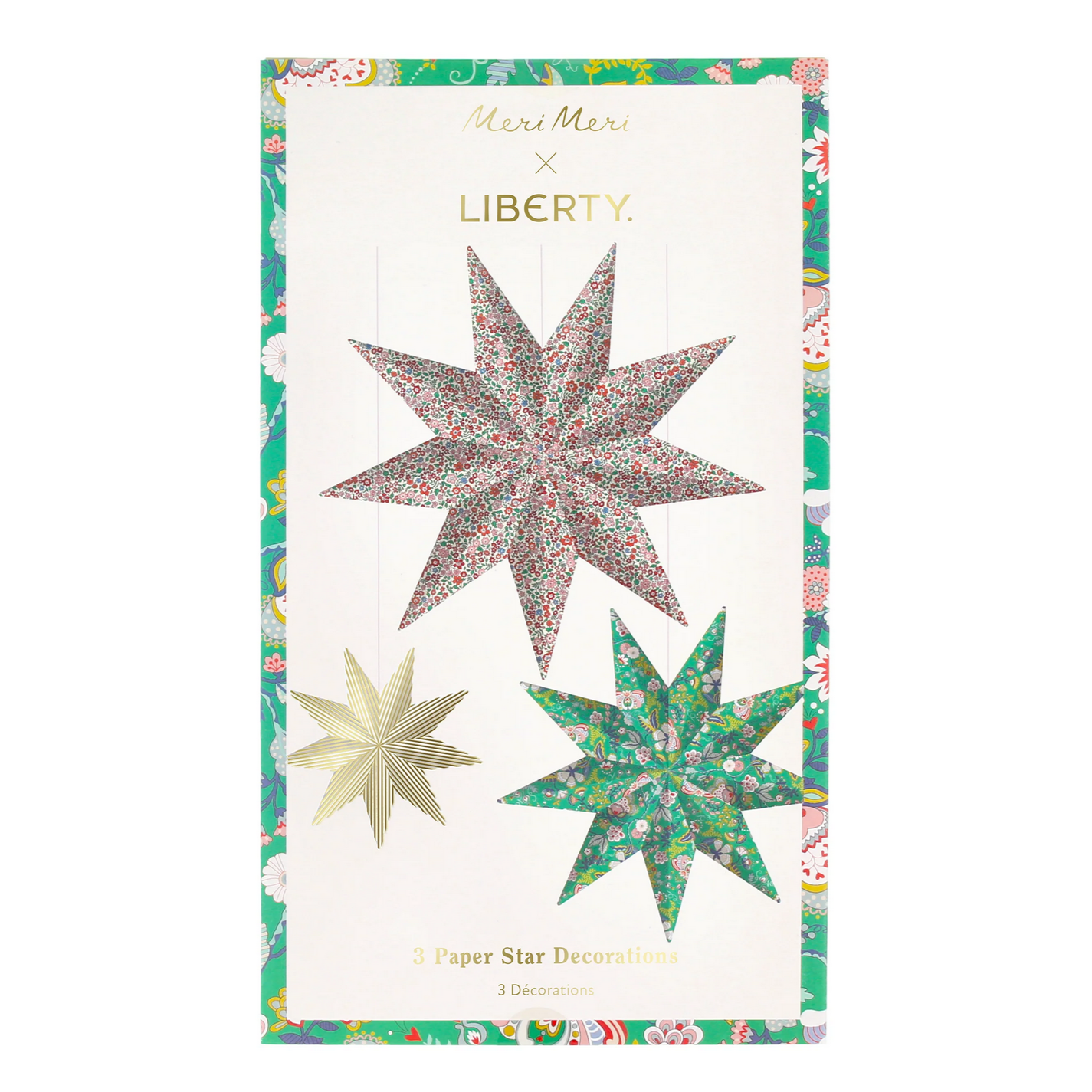 Set of three paper star decorations with floral patterns on a Liberty label