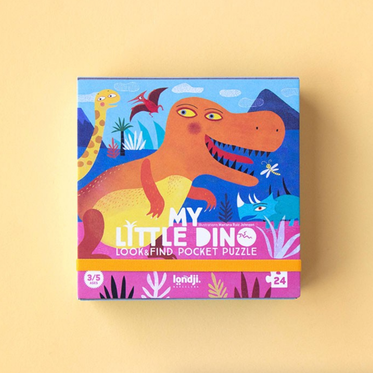 Colorful packaging of a children's puzzle with dinosaur illustrations on a beige background