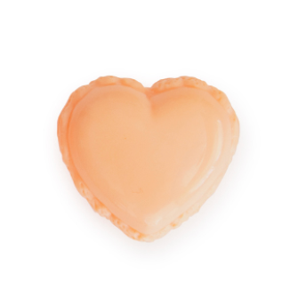 Heart-shaped lip gloss on a white background