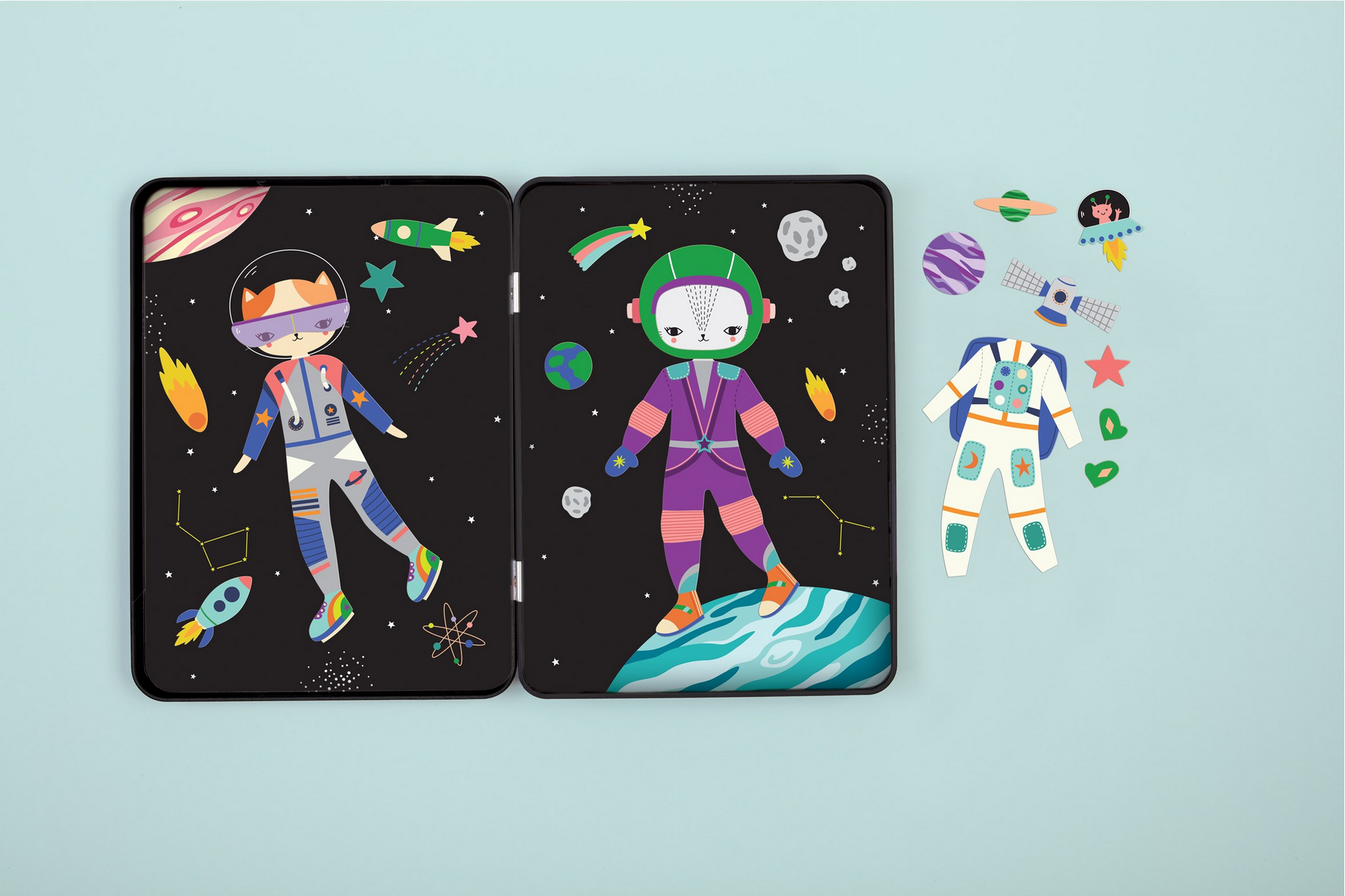 Two card designs featuring astronauts on a light blue background with space-themed illustrations.