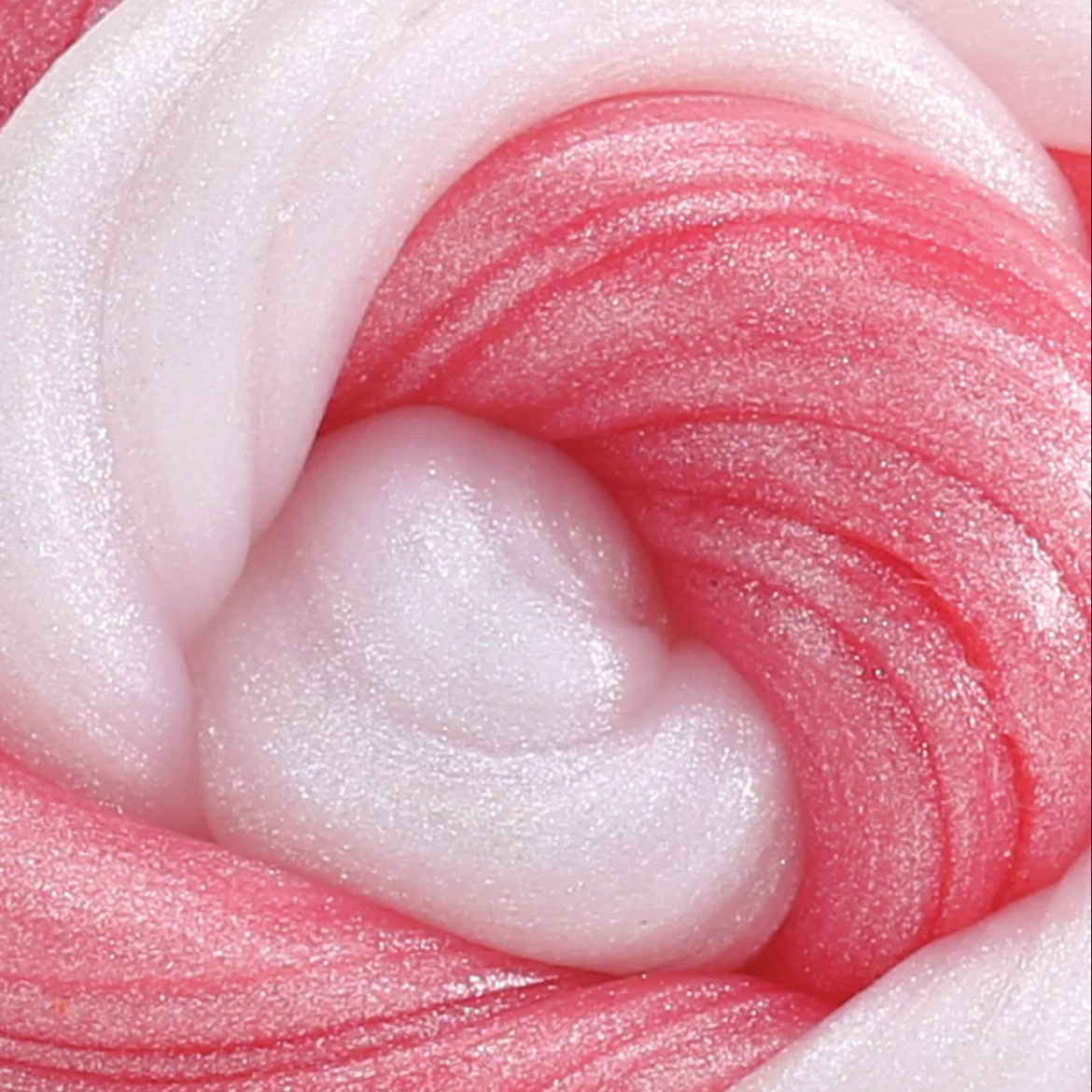Close-up of pink and white textured putty