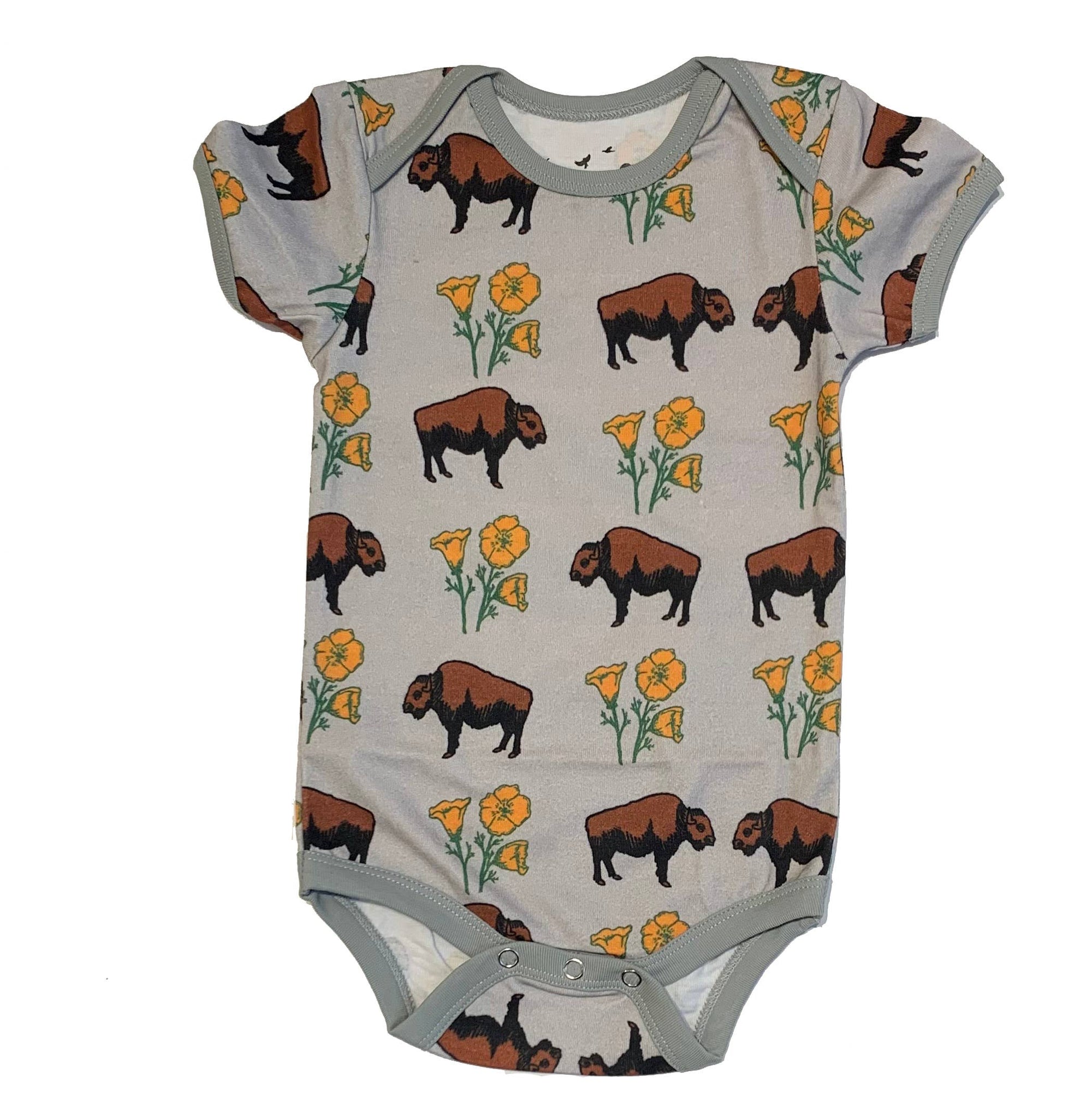 Baby onesie with bison and flower pattern on a white background
