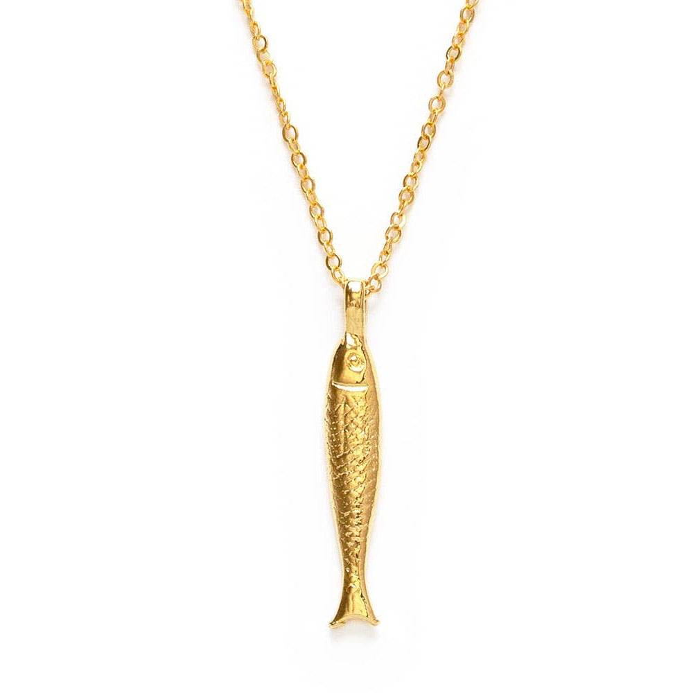 Gold fish-shaped pendant on a chain against a white background