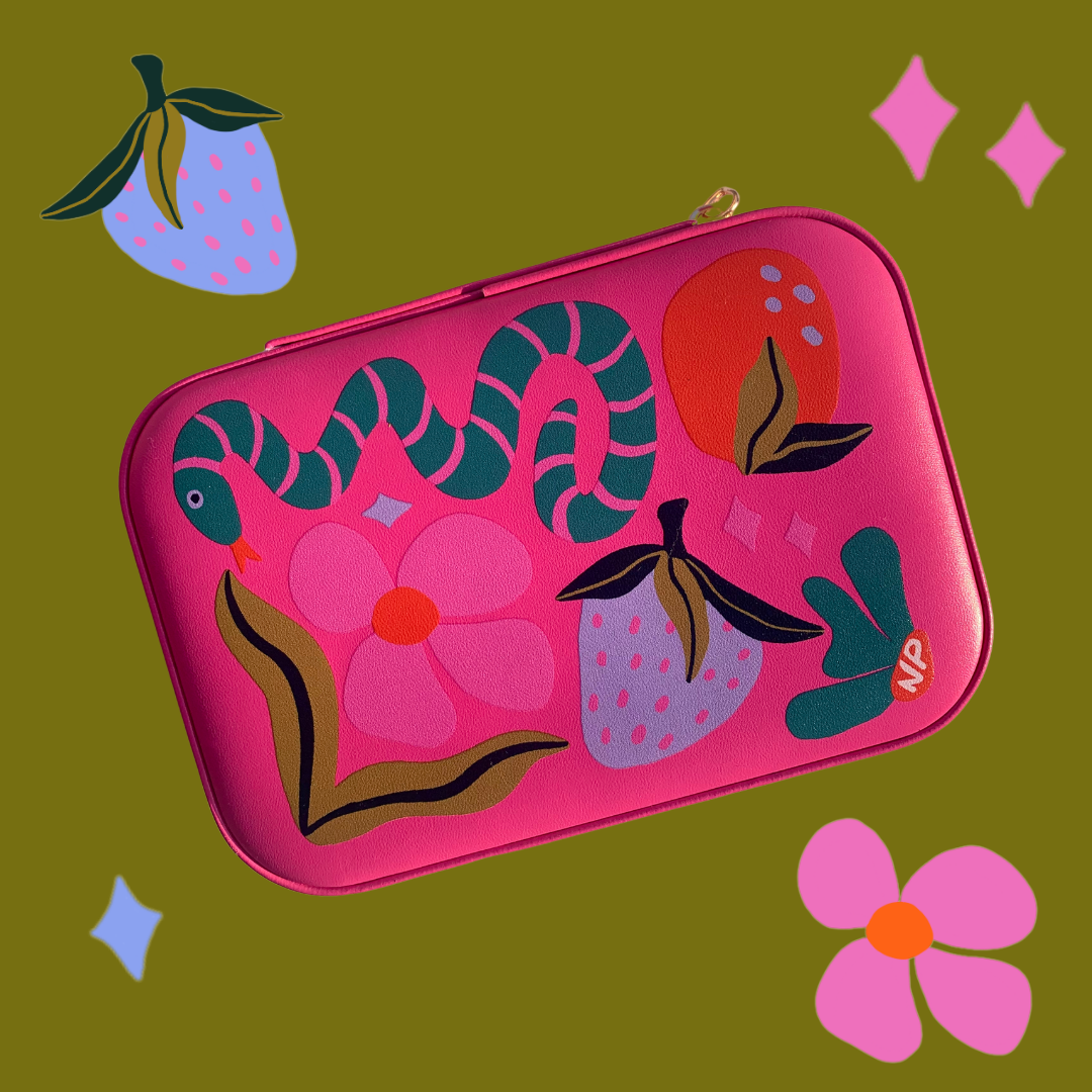 Pink pouch with floral and snake design on a green background