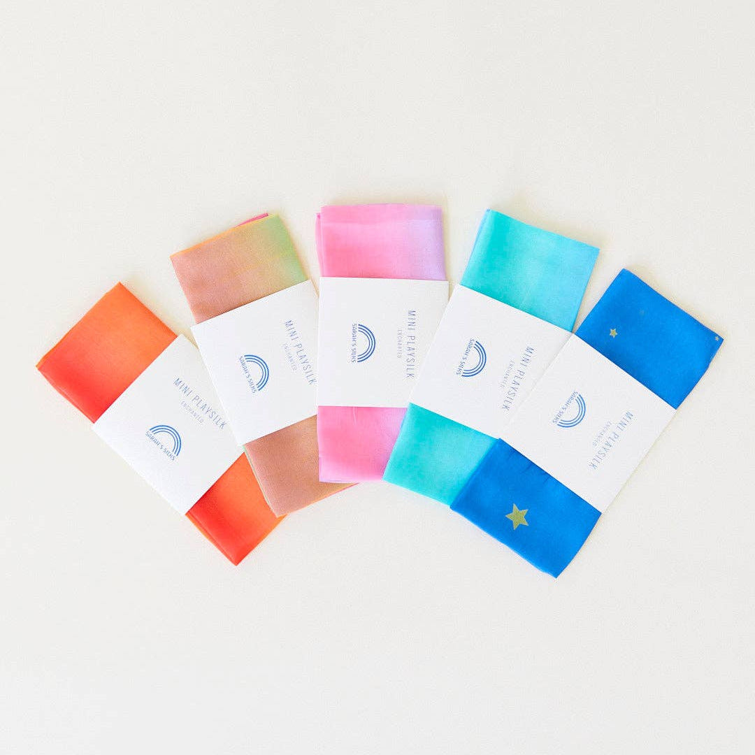 Set of colorful soap bars in packaging on a light background