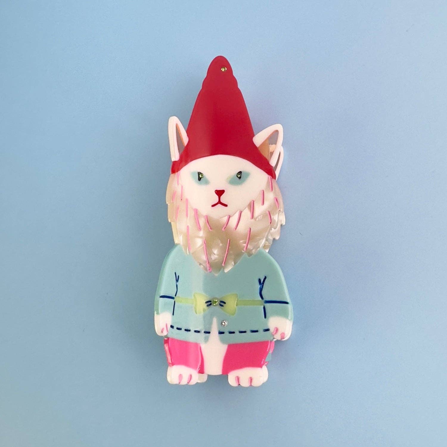 Cat-like creature with a red hat and colorful outfit on a light blue background