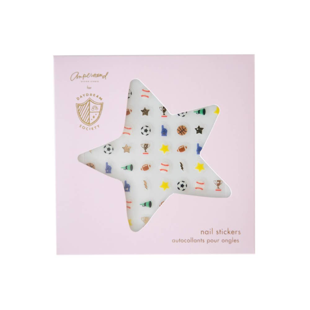 Star-shaped nail sticker with colorful designs on a pink background