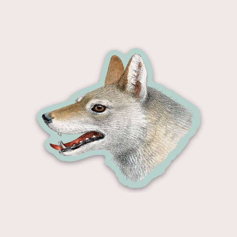 A die-cut sticker in the shape of a wolf's head with vintage illustration style.