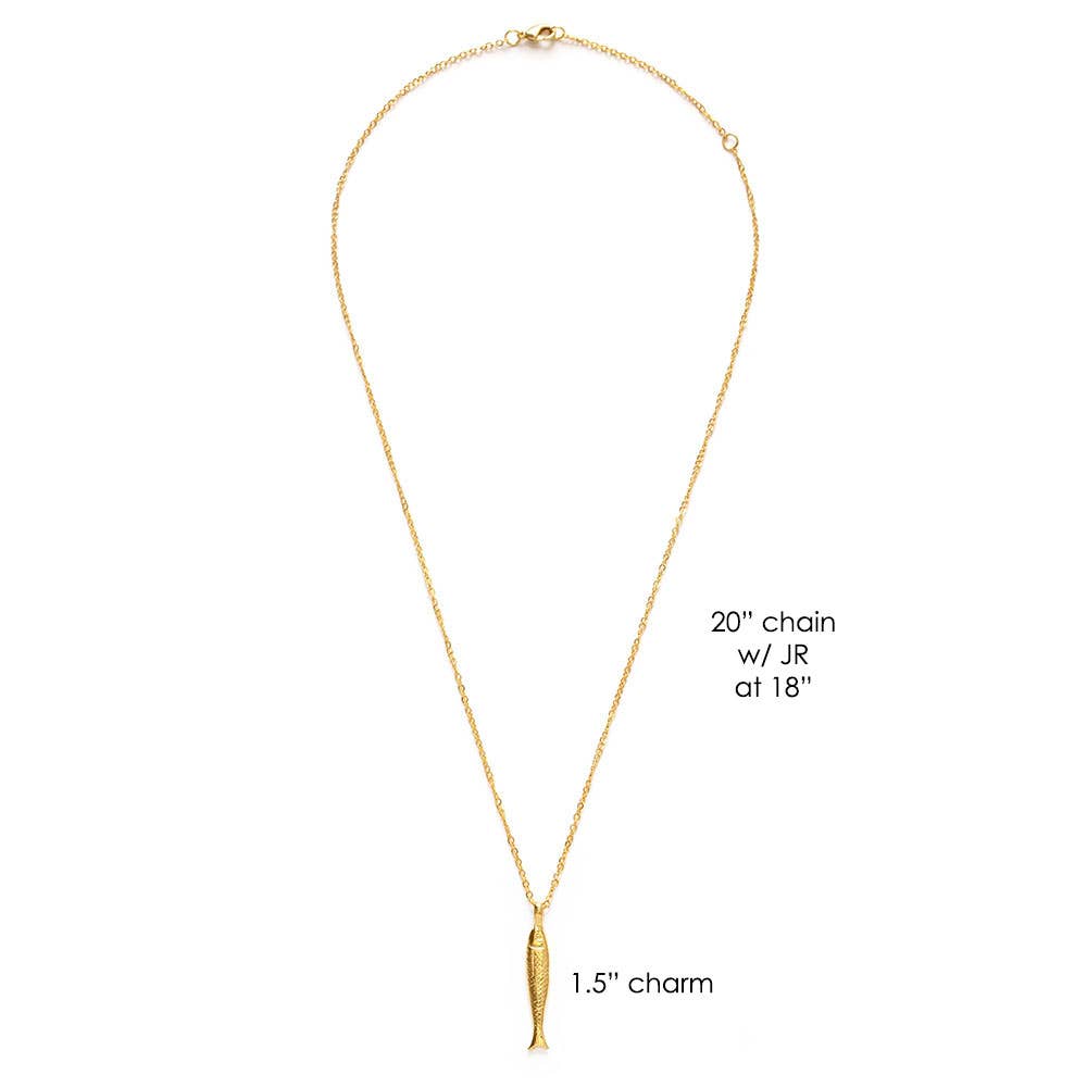 Gold necklace with a fish-shaped pendant on a white background
