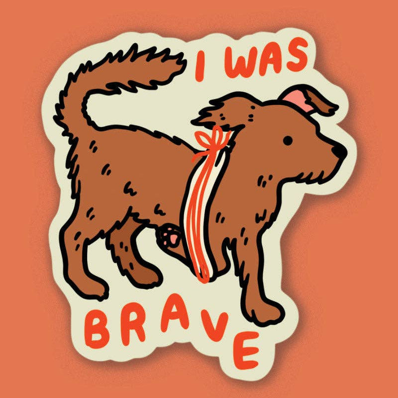 Sticker of a dog with a bandage and 'I was brave' text on an orange background