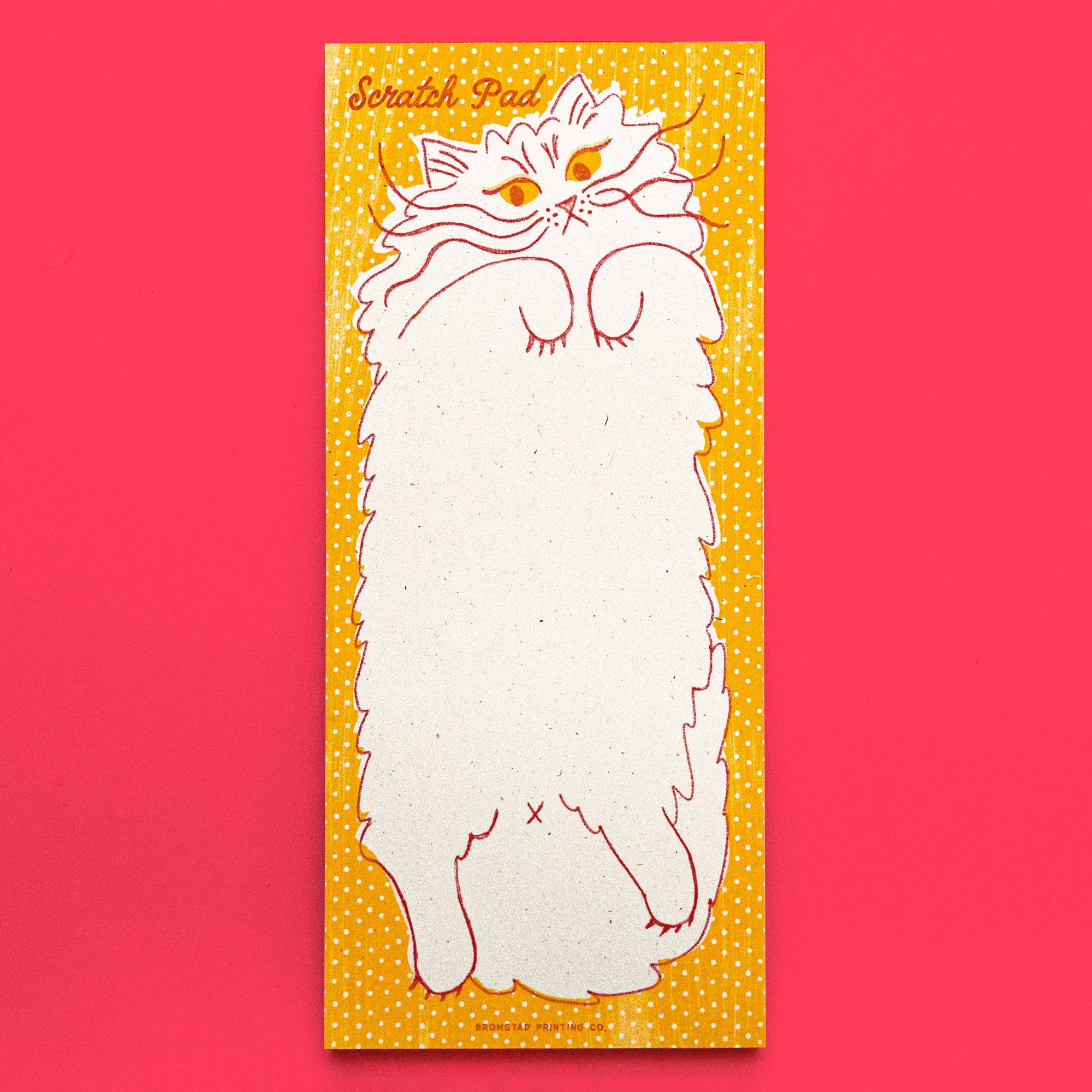 Scratch pad with a cat illustration on a red background