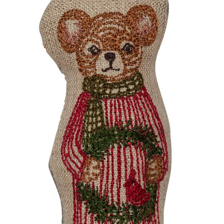 Decorative mouse ornament with a wreath and striped pants on a white background