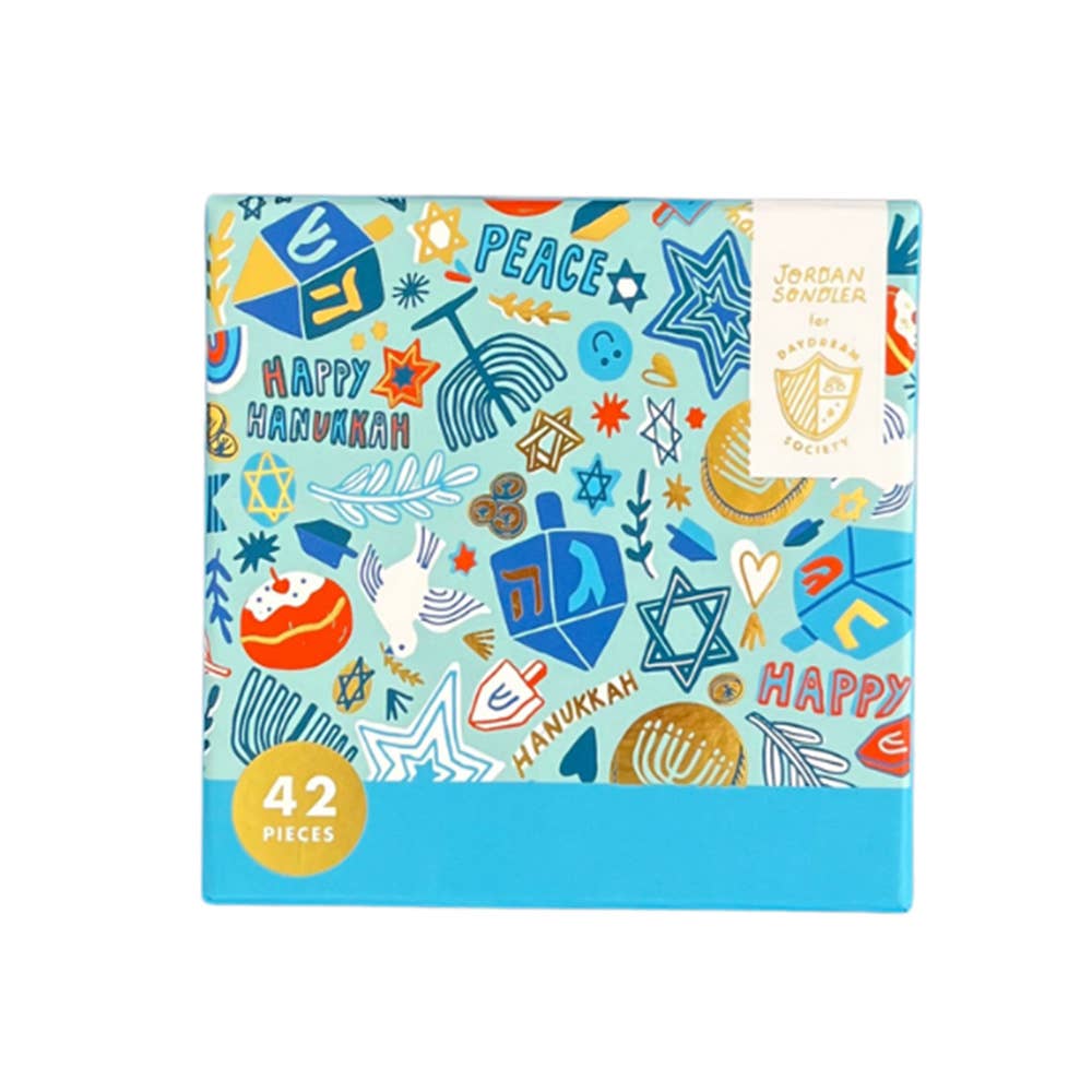 Box of Hanukkah-themed items with colorful designs on a white background