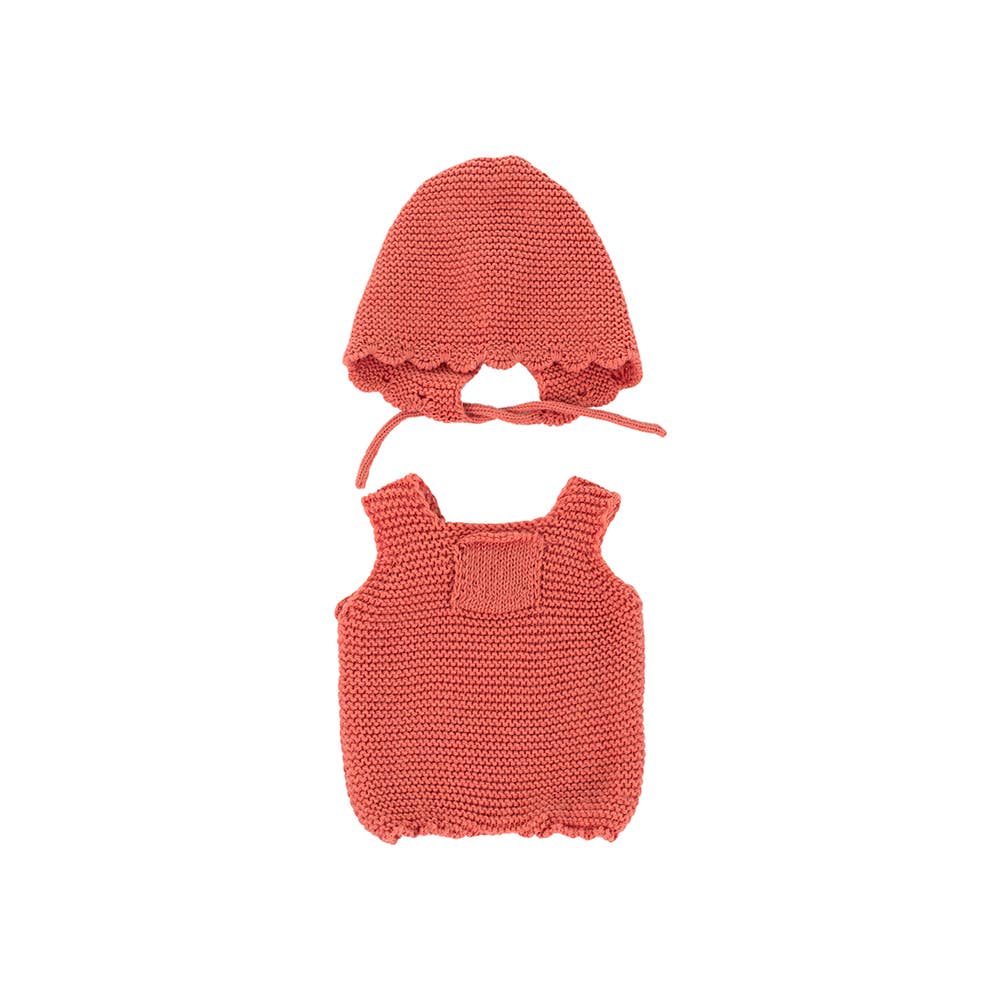 Knitted coral doll outfit with top and bonnet on a white background