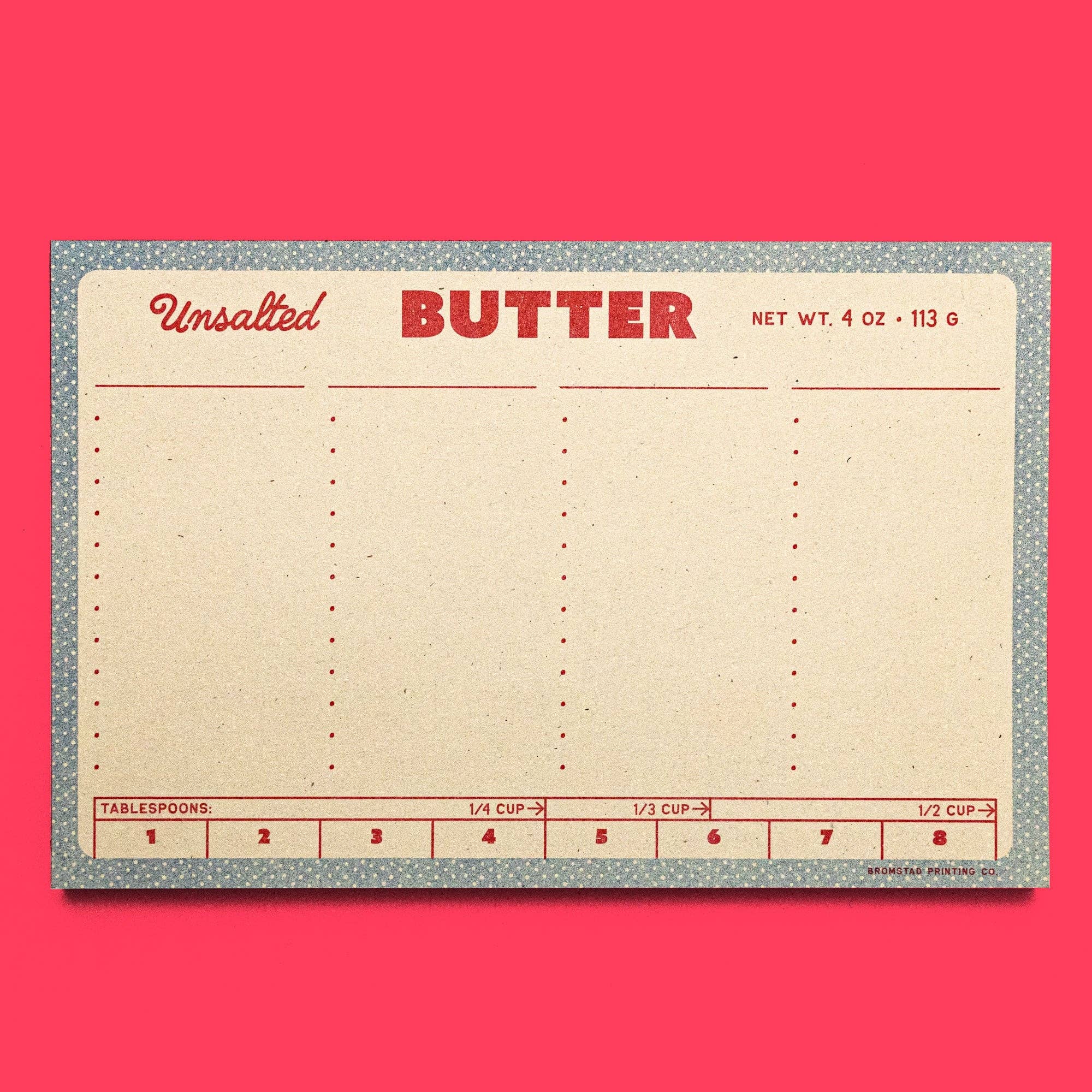 Butter packaging planner with measurement details on a pink background