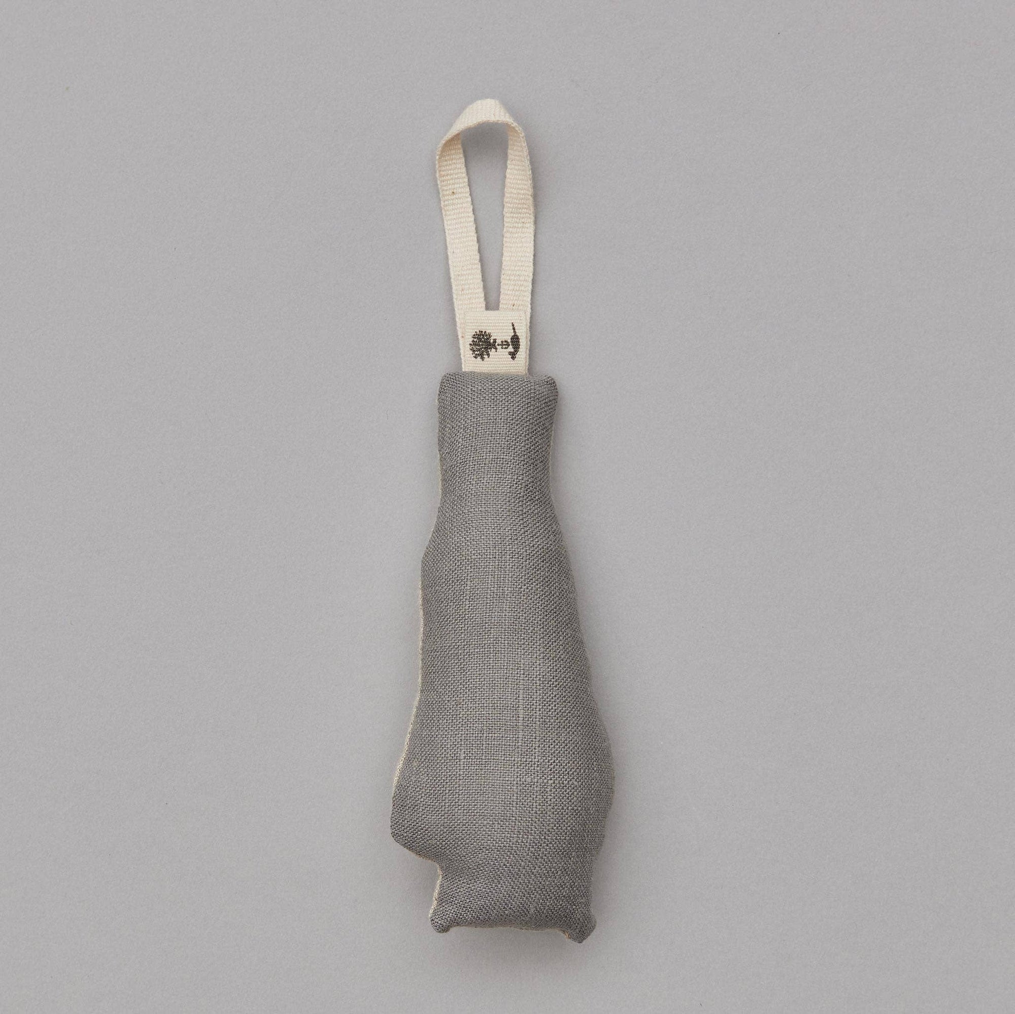 Gray fabric pouch with a strap on a gray background