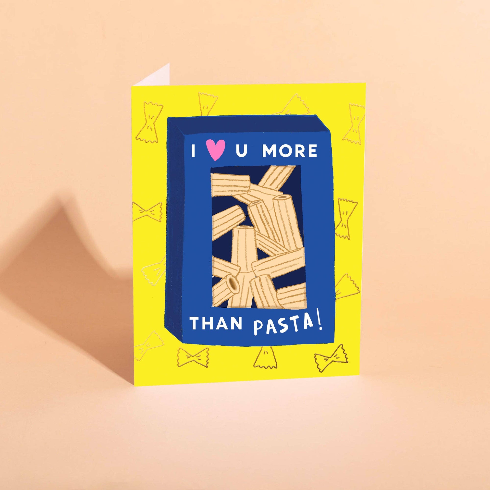 Greeting card with a box of pasta and text on a yellow background