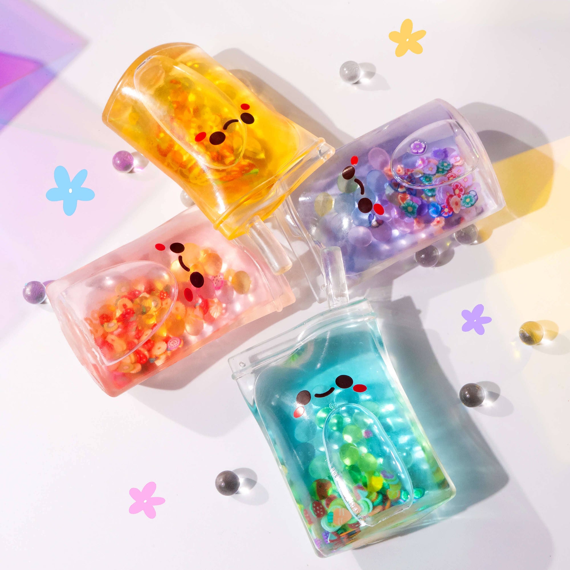Colorful gelatinous snacks with cute faces on a light background