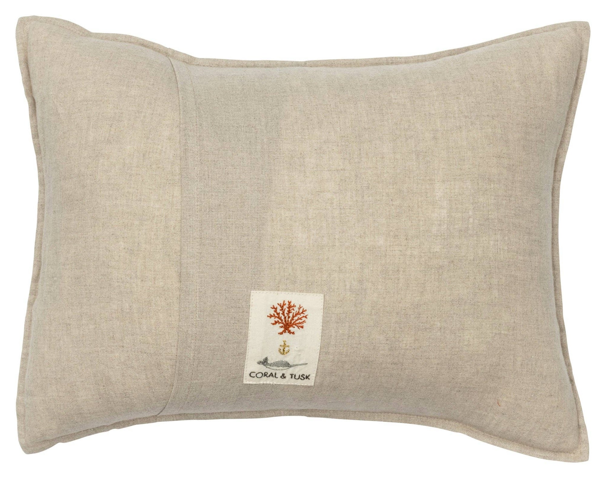 Beige pillow with a brand label on a white background