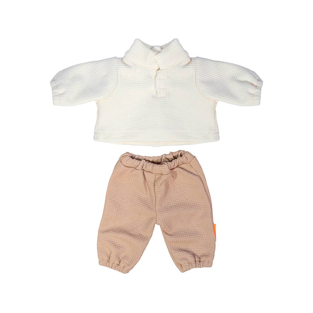 Children's outfit with white top and beige pants on a white background