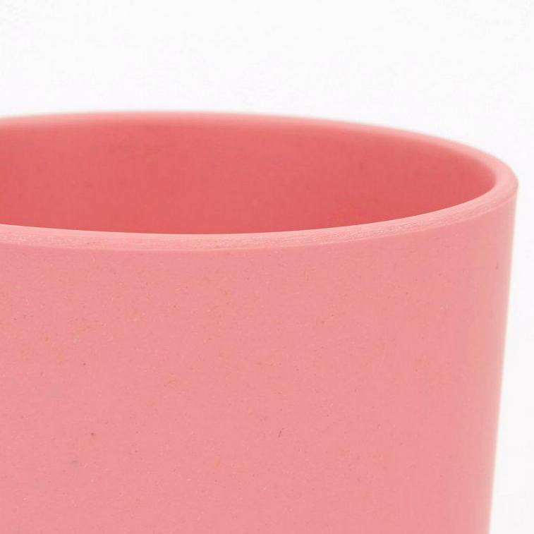 closeup on lip of pink cup