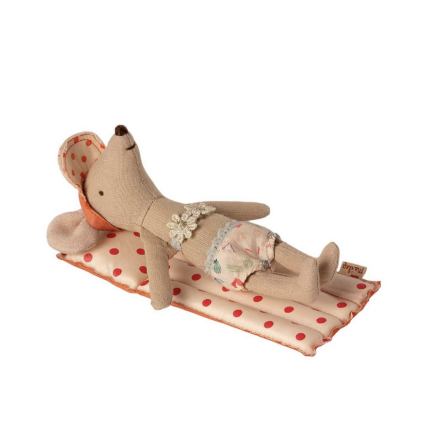 mouse with light shorts and red spotted hat on pool float
