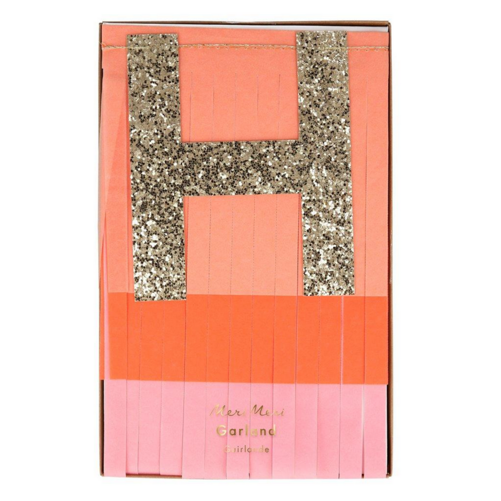 golden H in box with fringe