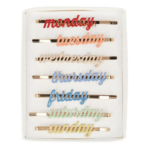 different colored enamel hairclips with the different days of the weeks