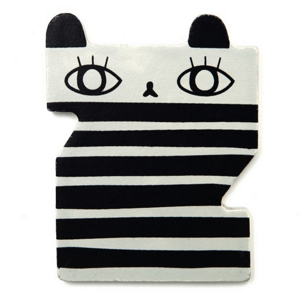 It is the letter Z. It is a thin piece of wood, black and white and looks like a zebra. By Suzy Ultman