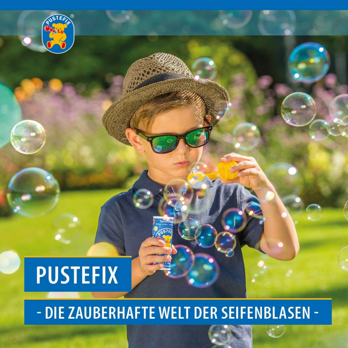 little boy blowing bubbles
