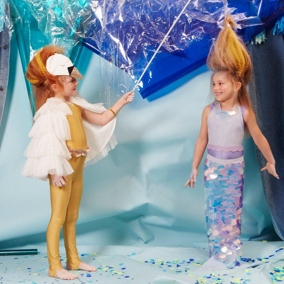 2 girls wearing different dress up costumes