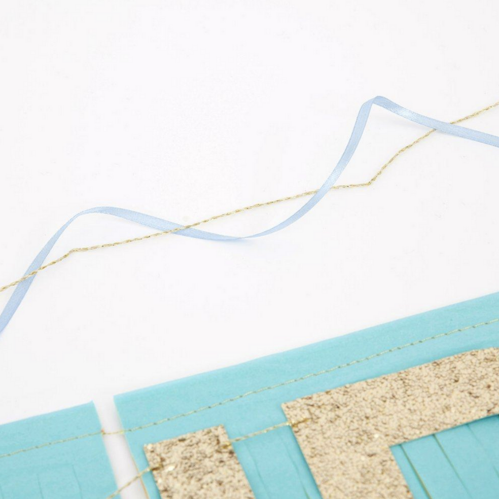 close up of blue and gold string