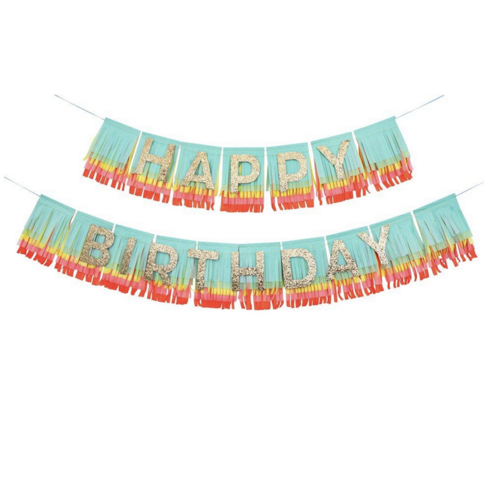 rainbow colored fringe garland with gold glittered Happy birthday letters on top