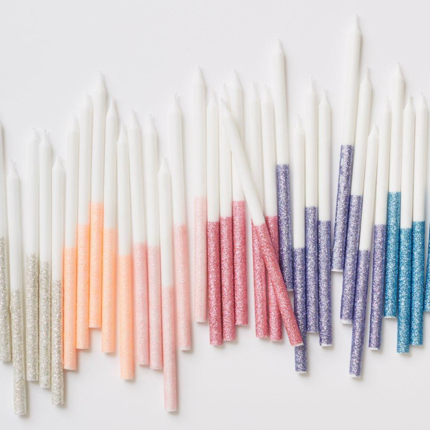 many colored candles on a table