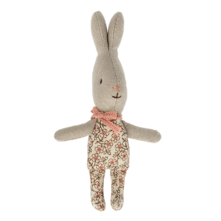 A small plush toy rabbit with soft pink flower-printed fabric and a cute bow.