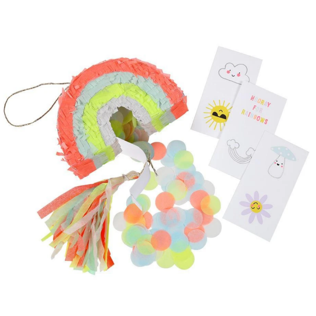 rainbow pinata open with contents spilling out