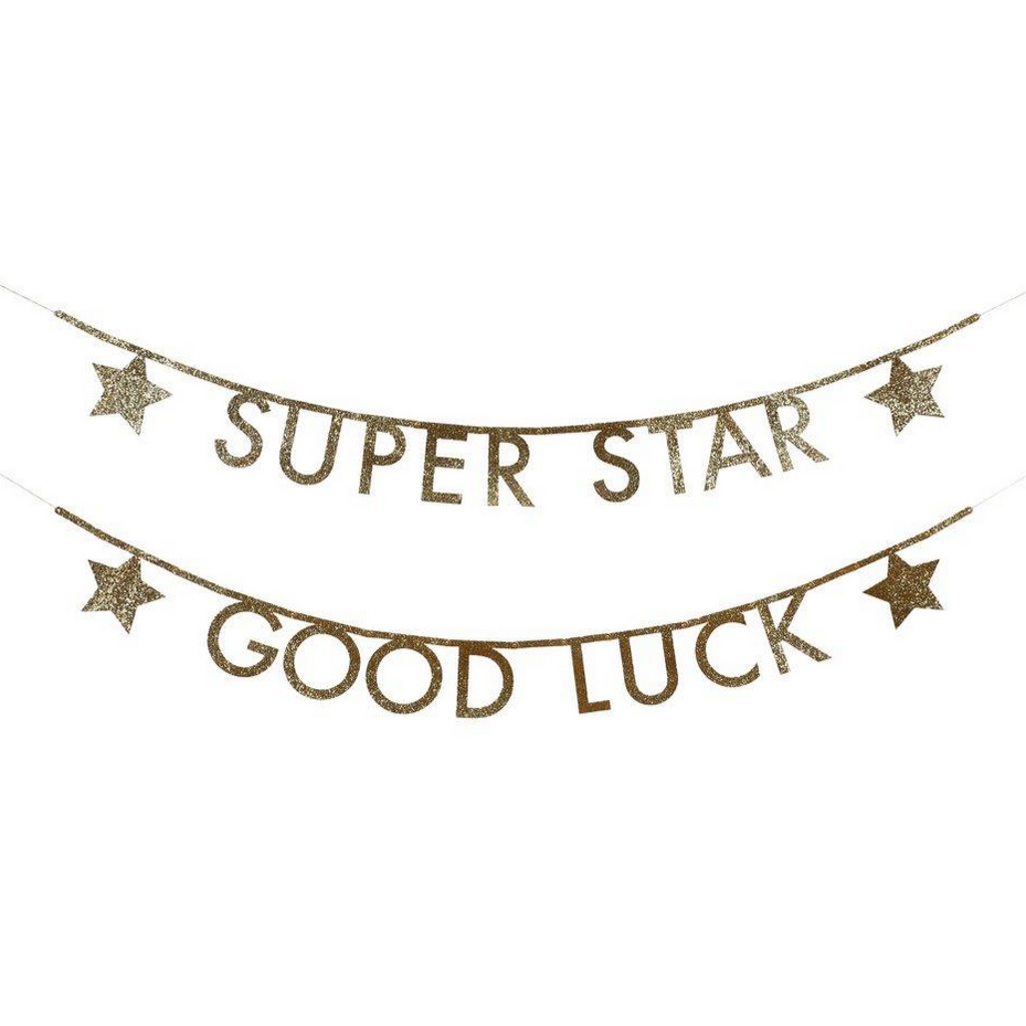 gold glitter sign reading "super star" and "good luck" with glitter stars