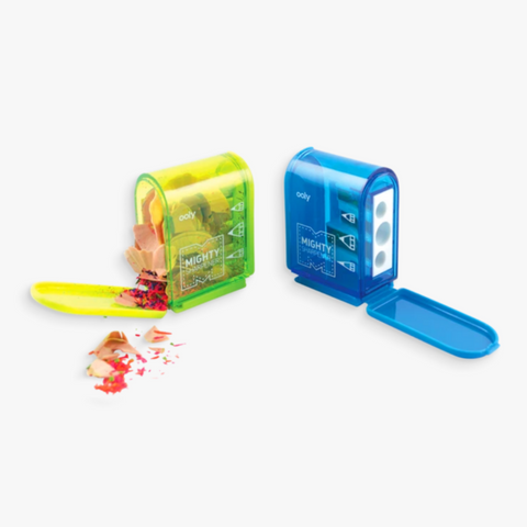 green and blue pencil sharpeners opened with pencil shavings