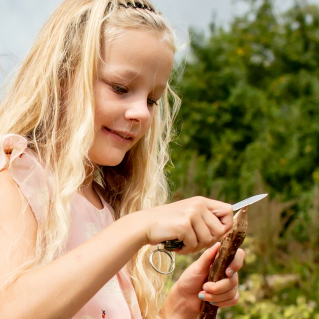 girl whittling wood