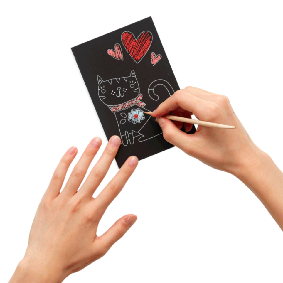 hands scratching off black layer revealing color on cat and hearts