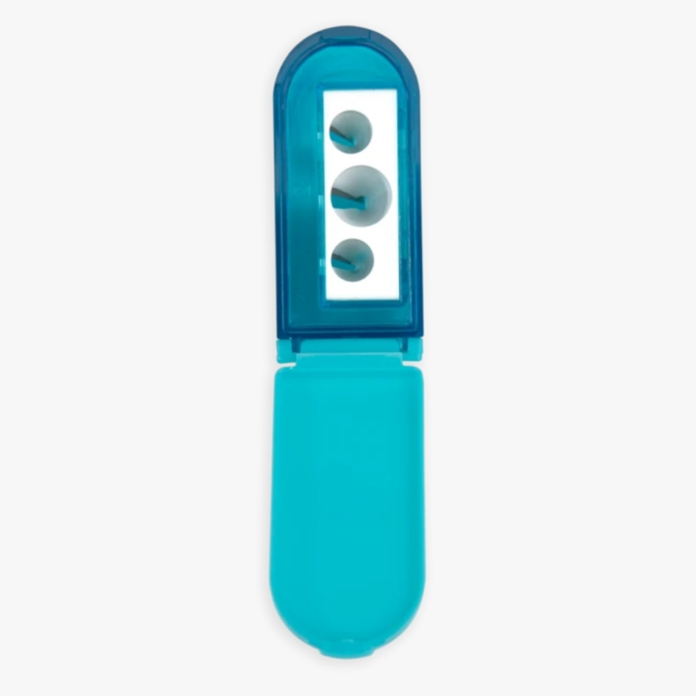 blue pencil sharpener opened showing three different size holes