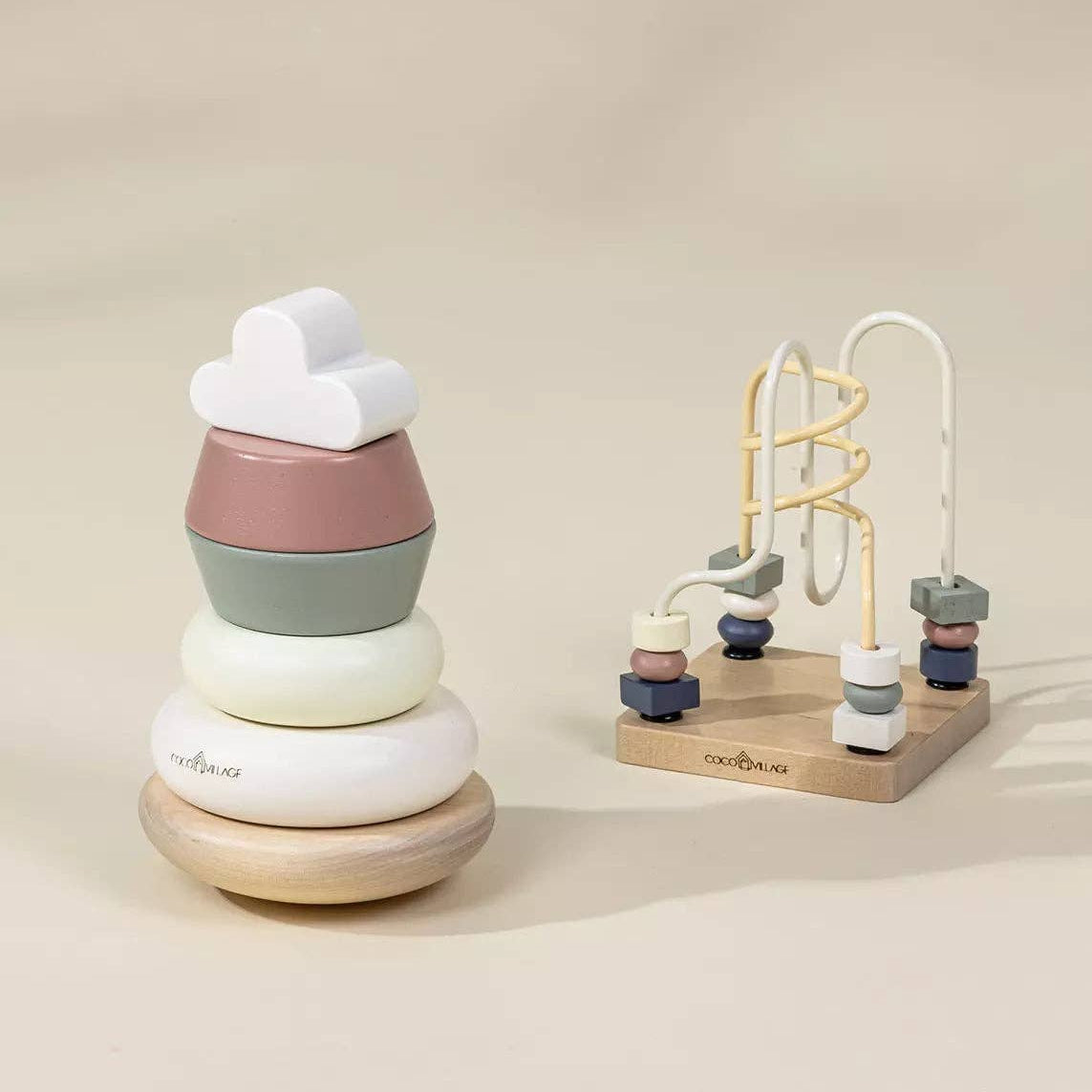 Stacking toy and climbing toy on a beige background